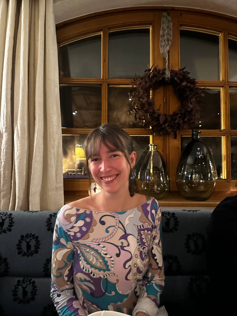 Lara smiling in warm evening light